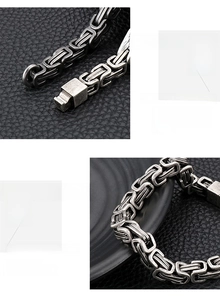 Detail of vintage Byzantine stainless steel chain bracelet with metallic clasp on leather