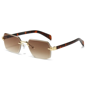 Lunettes de soleil octogonales sans monture avec verres dégradés et détails dorés