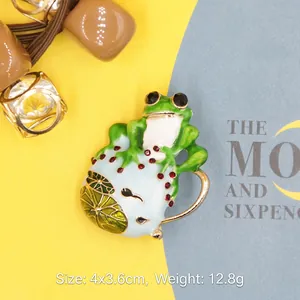 Creative cute frog enamel brooch with red rhinestones and lily pad decor for women