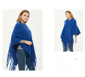 Close-up detail of Royal Blue boucle knit shawl featuring long fringe trim and thick texture