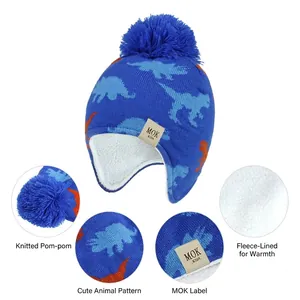 Knitted kids dinosaur winter earflap hat with warm fleece lining and pompom details