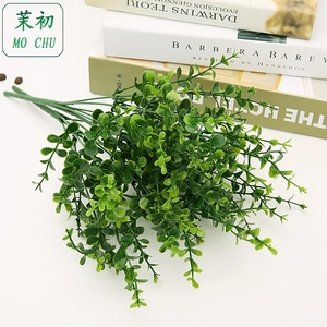 Detail view of artificial eucalyptus branches with silk leaves for home floral decoration