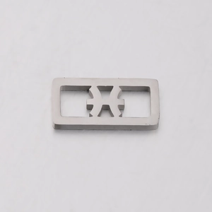 Macro shot of a silver square stainless steel charm with a hollow minimalist pattern