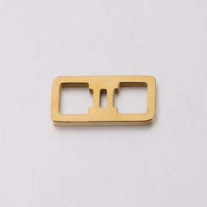 Macro view of a gold square hollow 12 constellations stainless steel pendant connector