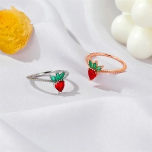 Cute strawberry rings in silver and rose gold finishes with red heart-shaped stones