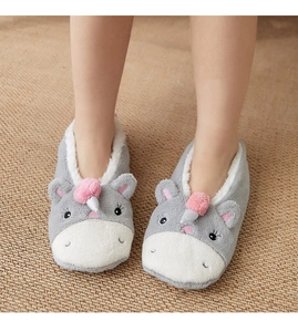 Detailed macro view of coral fleece socks with warm lamb wool lining and cute animal design