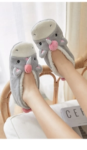 Close-up of thick grey coral fleece slipper socks with warm faux lamb wool lining and 3D ears