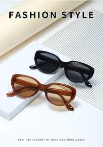 Detail shot of cat eye sunglasses showing temple dimensions and glossy frame finish