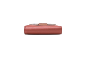 Close-up of brown PU leather wallet texture and metallic buckle closure on folding card holder