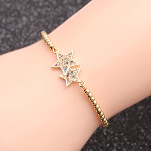 Gold beaded chain bracelet with pavé colorful zircon double star pendant on wrist