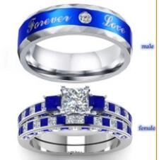 Matching silver and blue couple rings with Forever Love engraving and crystal inlay