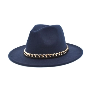 Detail of navy blue wool jazz hat featuring a chunky gold metal chain on the crown