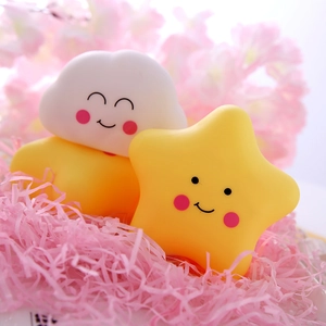 Cute star and cloud silicone night lights set for kids on pink decorative paper