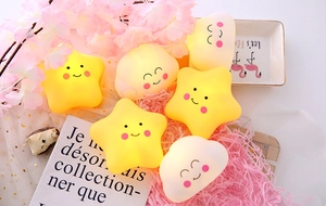 Cute star and cloud night lights emitting soft warm light on a pink decorative background