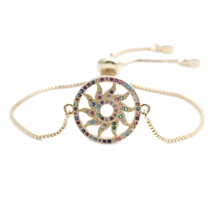 Golden chain bracelet with a sunburst pendant inlaid with colorful zircon gemstones