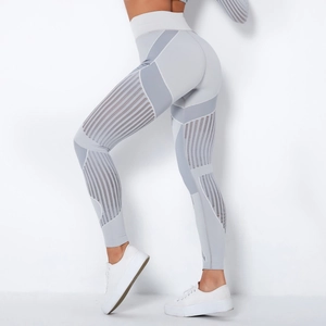 Detail of light grey seamless yoga leggings with high waist and breathable mesh panels