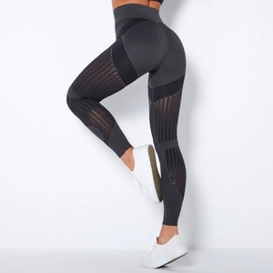 Detailed back view of high waist dark gray seamless yoga leggings with mesh stripe texture