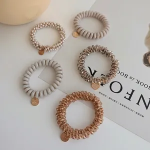 Five-piece set of pearl and crystal beaded spiral hair ties with gold metal charms