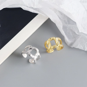 Detail of S925 sterling silver rings with chain texture and hammered foil finish