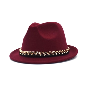 Elegant wine red wool fedora hat with a thick gold metal chain for stylish winter wear