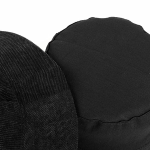 Detailed close-up of black corduroy and cotton twill textures on a bucket hat