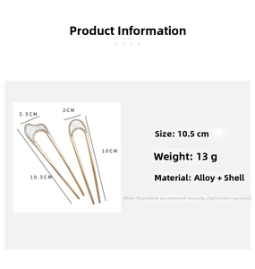 Detail showing two golden U-shaped hair pins with shell inlay, 10.5cm length and 13g weight