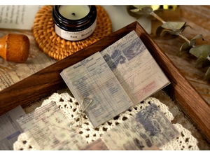 Detail of vintage floral scrapbooking paper with retro script and translucent texture