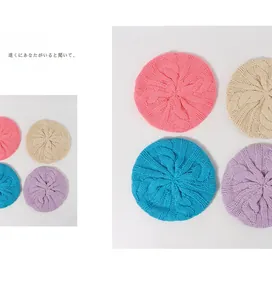 Detail of cable knit berets for girls in pastel pink beige blue and purple colors