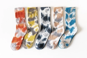 Detailed view of 5 pairs of tie-dye cotton crew socks in vibrant assorted colors