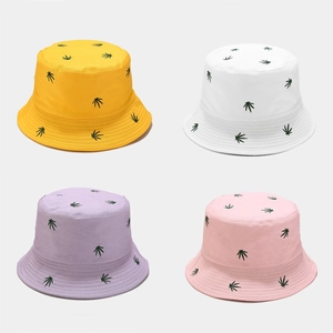 Leaf embroidery bucket hats in yellow, white, purple, and pink with a double-sided design