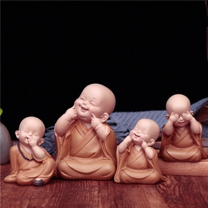 Set of four cute monk figurines in brown robes, nodding car interior ornaments