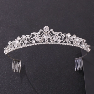 Detailed close-up of a silver bridal tiara with sparkling rhinestones and hair combs