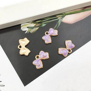 Pendentifs nœuds en émail violet avec bordure dorée pour création de bijoux DIY