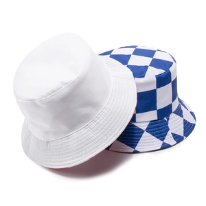 Reversible bucket hats in solid white and blue checkerboard patterns on white background