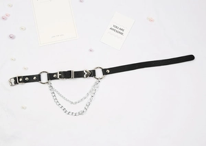 Punk leather choker detail with silver rings, heart pendant, and double layered metal chains