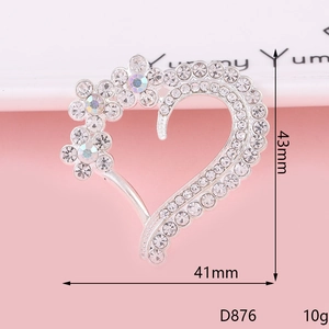Macro detail of heart flower brooch with white and aurora borealis crystals 43mm