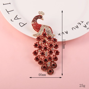 Detailed view of large colorful peacock brooch with dimensions 113mm x 46mm and 25g weight