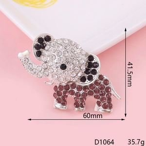 Detailed view of an elephant brooch with white and purple rhinestones, 60mm by 41.5mm size