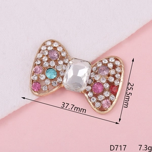 Sparkly rhinestone bow accessory with measurements 37.7mm x 25.5mm for DIY decor