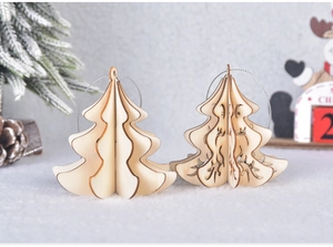 Detailed view of DIY 3D wooden Christmas tree ornaments with intricate carvings and silver strings