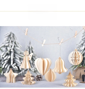 Close-up of 3D laser-cut wooden Christmas ornaments hanging on a string for festive decor