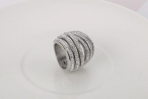 Detailed close-up of a multi-layer silver ring featuring pave-set white cubic zirconia stones