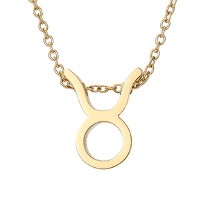 Detailed view of the Taurus zodiac sign pendant on a golden stainless steel chain