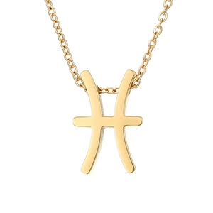 Detail of golden Pisces zodiac symbol pendant on a delicate stainless steel chain