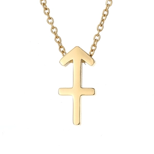 Detailed close-up of golden Sagittarius zodiac arrow pendant on a delicate chain necklace
