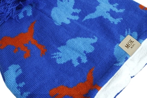Detailed macro view of soft white faux sheep fleece lining inside a blue knitted kids hat