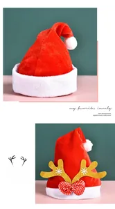 Close-up of red plush Christmas hats with sequined antlers and polka dot bow details