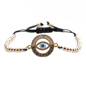 Detailed close-up of Evil Eye bracelet with zircon inlay and tricolor metal beads