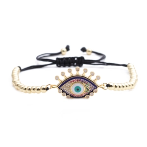 Gold beaded Evil Eye bracelet with colorful crystals and black adjustable braided cord