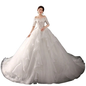 Elegant off-shoulder lace wedding dress with long train and sparkling sequins